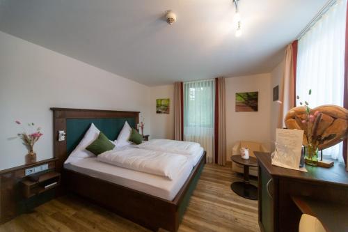 Ένα ή περισσότερα κρεβάτια σε δωμάτιο στο Hotel Restaurant Auerhahn