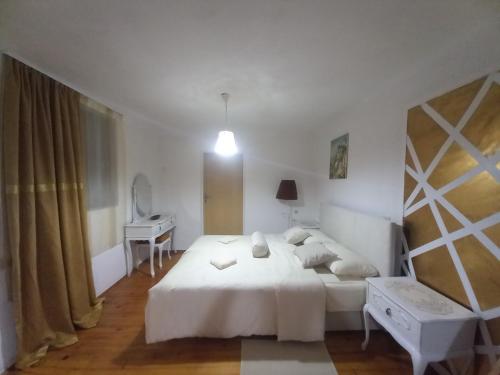 Säng eller sängar i ett rum på Apartmani Dujakovic