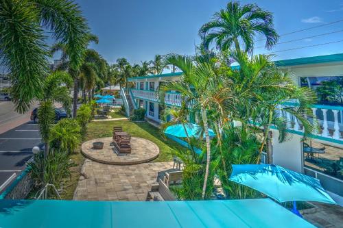 a view from the balcony of a resort with palm trees at Horizon by the Sea Inn in Fort Lauderdale