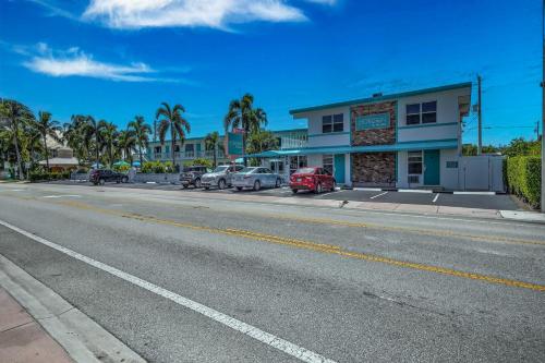 a street with cars parked on the side of a road at Horizon by the Sea Inn in Fort Lauderdale