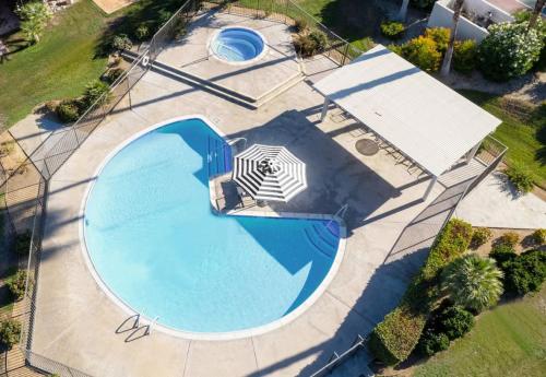 an overhead view of a large swimming pool at Cali Desert Life - Pool, Golf Cart, Tennis, Bikes in Indian Wells