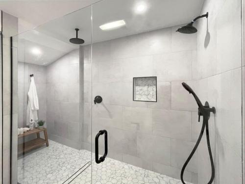 a shower with a glass door in a bathroom at Cali Desert Life - Pool, Golf Cart, Tennis, Bikes in Indian Wells