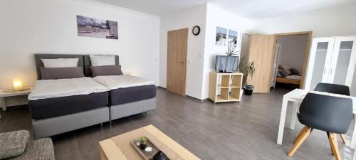 Ένα ή περισσότερα κρεβάτια σε δωμάτιο στο Ferienwohnung Mühlenbach