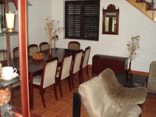 a dining room with a table and chairs at Holiday home Bokokotorski zaliv in Kotor