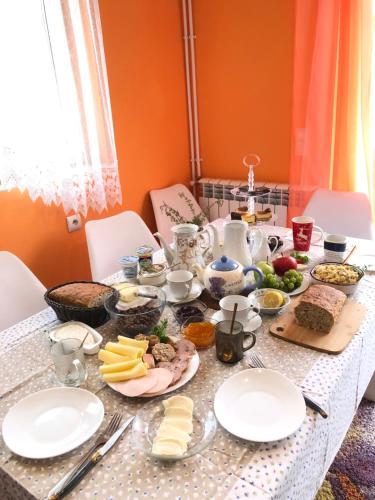 a table with plates of food on it at CHEZ YAYA Bogumiła Szeląg in Zalasowa