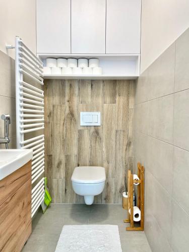 a bathroom with a toilet and a sink at my Vista by Mountain ways in Rokytnice nad Jizerou