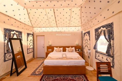 a bedroom with a bed in a room at Shrinath Desert Camp in Jaisalmer