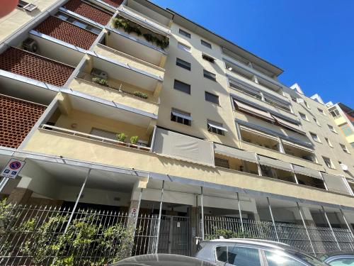 an apartment building with cars parked in front of it at B&B Royal Prato in Prato