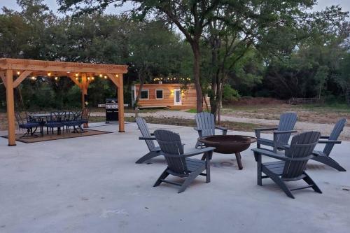 a group of chairs and a table on a patio at The Lonely Bull Luxury Container Home on 5 Acres in Weatherford