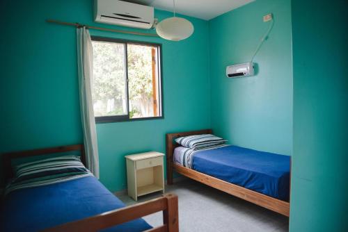 Ένα ή περισσότερα κρεβάτια σε δωμάτιο στο Hostel Trotamundos