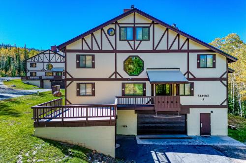 a large house with a gambrel roof at Alpine Condo #A5 in Brian Head