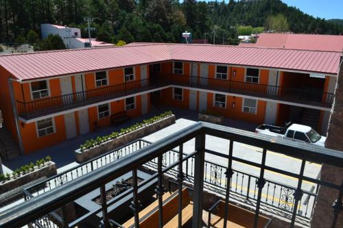 an aerial view of a building with a red roof at Villa Santa Cruz Creel in Creel