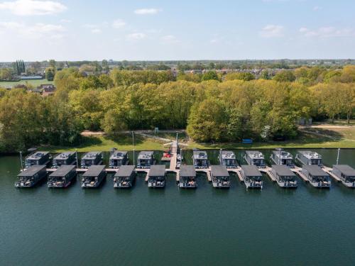 an aerial view of a marina with a bunch of boats at Houseboat at Mookerplas in Middelaar