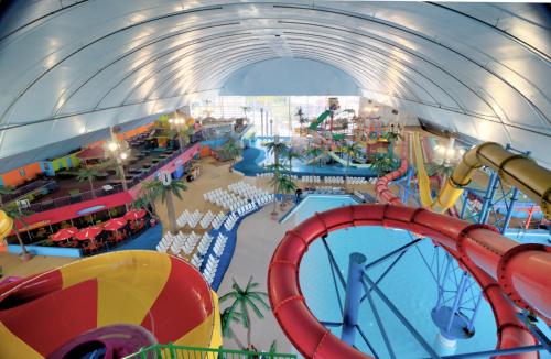 an indoor water park with a roller coaster at No available not in Welland