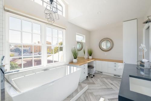 a bathroom with a tub and a desk and a window at 4221 Urban oasis in Hillcrest Mission Hills in San Diego