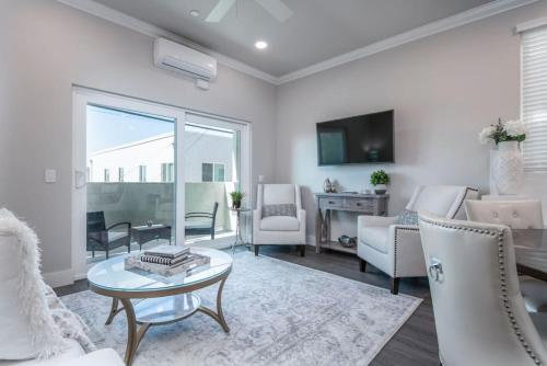 a living room with a couch and a table at 4048 Stylish condo in Hillcrest Mission Hills in San Diego