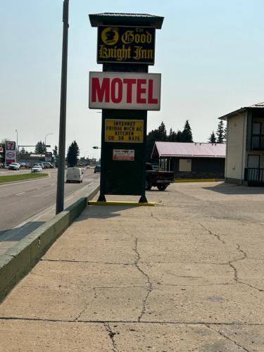 a motel sign on the side of a road at Goodknight Inn in Lloydminster