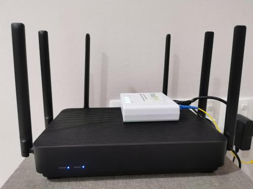 a black router with a white device on top of it at Icon Residenz Icon City, Petaling Jaya by De Harlequins Guesthouse in Petaling Jaya