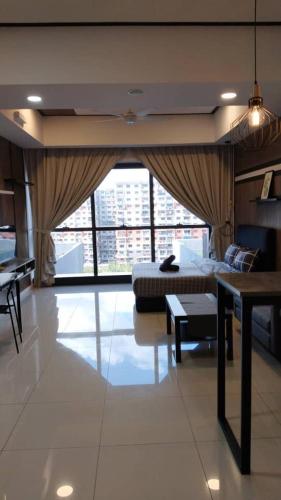 a bedroom with a bed and a large window at Icon Residenz Icon City, Petaling Jaya by De Harlequins Guesthouse in Petaling Jaya
