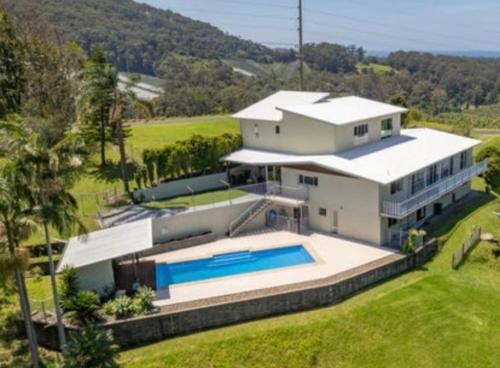 an aerial view of a house with a swimming pool at Ocean View Oasis, Coffs Harbour in Coffs Harbour