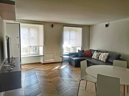 a living room with a couch and a table at Casa Rocca in Roccaforte Mondovì
