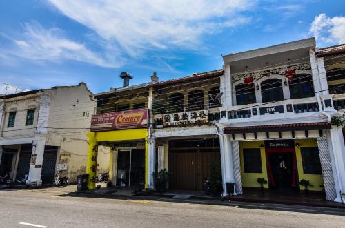 a row of buildings on a city street at The Egerton Melaka in Malacca