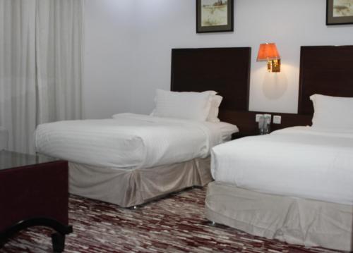 Postel nebo postele na pokoji v ubytování Carawan Al Khaleej Hotel Olaya