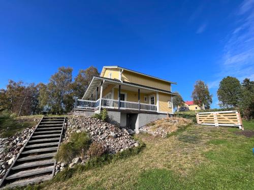 a house on top of a hill with stairs at Ferienhaus Anders in Terjärv