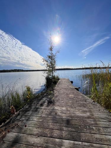 a wooden bridge over a body of water at Ferienhaus Anders in Terjärv