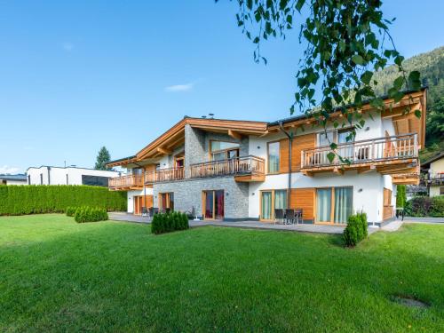 an image of a house with a yard at Luxurious Apartment in Zell am See near Ski Area in Zell am See