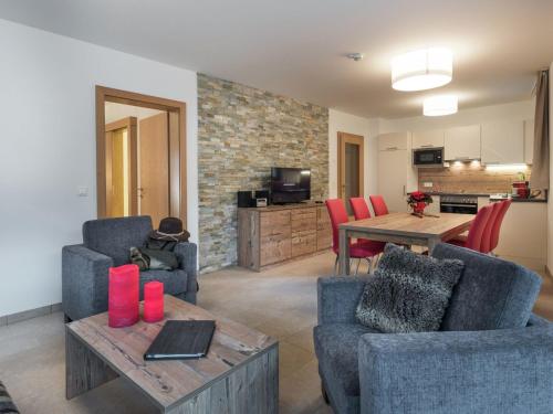 a living room with two chairs and a table at Luxurious Apartment in Zell am See near Ski Area in Zell am See