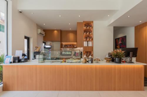 a large kitchen with a large counter top at STAYS HOTEL in Kuala Lumpur