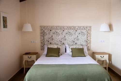 En eller flere senge i et værelse på Casa Rural Alcolea del Pinar