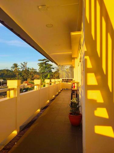 a balcony of a building with lights on it at MAMORI HOTEL in Allen