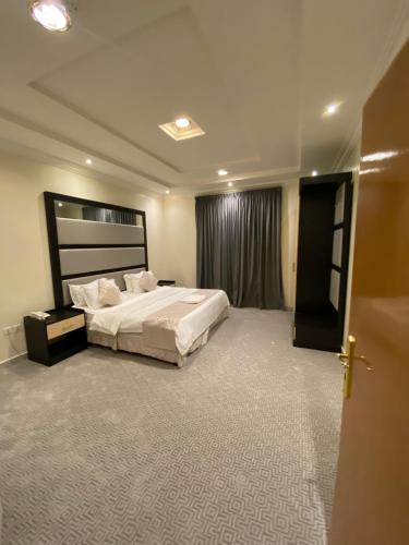 Кровать или кровати в номере راحة الضيف للأجنحةالفندقية