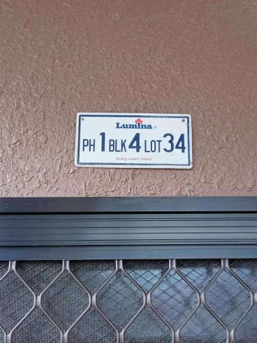 a license plate on the side of a building at 6 - Affordable 2-Storey House in Cabanatuan City in Cabanatuan