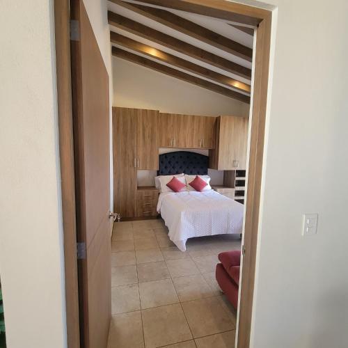 Postel nebo postele na pokoji v ubytování Casita En Patzcuaro