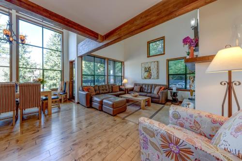 a living room with couches and a table at Northern Lights 21 in Whistler