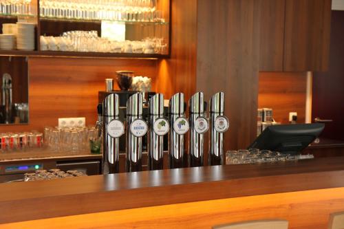 a bar with a bunch of bottles of wine at Seminarhotel Springer Schlössl in Vienna