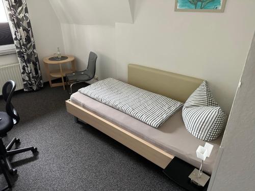 Postel nebo postele na pokoji v ubytování Gasthaus Unikat