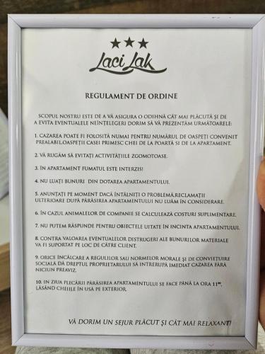 a sign for the last lab restaurant de cuisine at Laci lak modern apartment in Oradea