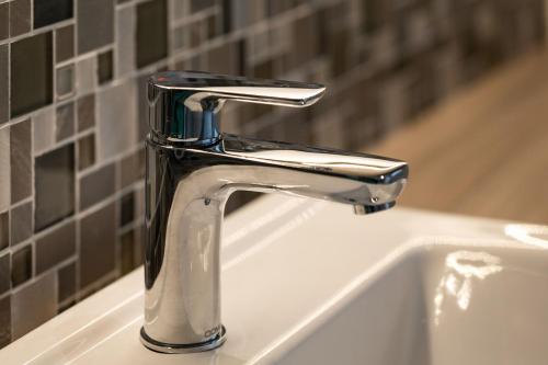 a bathroom sink with a chrome bathroom faucet at Aonach in Kingussie