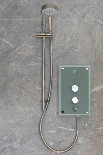 a soap dispenser on a wall in a bathroom at Aonach in Kingussie