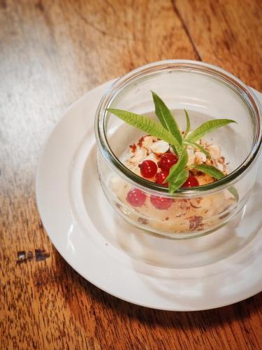a bowl of food on a plate on a table at Sud Hôtel Restaurant in Bastia