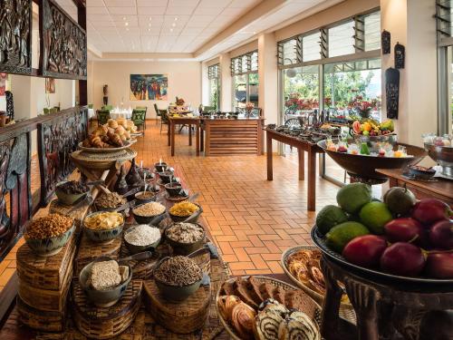 a store filled with lots of baskets of food at Hotel des Mille Collines in Kigali