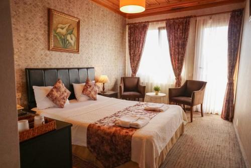 Postel nebo postele na pokoji v ubytování Eskibağ Butik Hotel