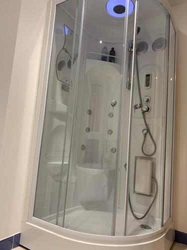 a shower with a glass door in a bathroom at Guest suite Annex private room in Saint Ives