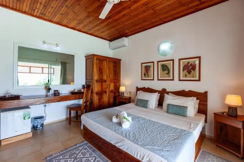 Ένα ή περισσότερα κρεβάτια σε δωμάτιο στο Villa Anse La Blague