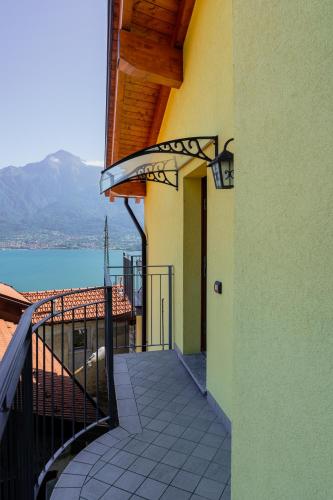 a balcony of a house with a view of the water at Casa Fausto in Vercana