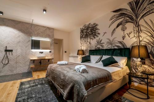 a bedroom with a large bed and a tv at Borgo Rotondo in San Giovanni in Persiceto